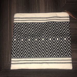 New “Tribe Alive” zipper clutch bag with leather tassel zip pull.